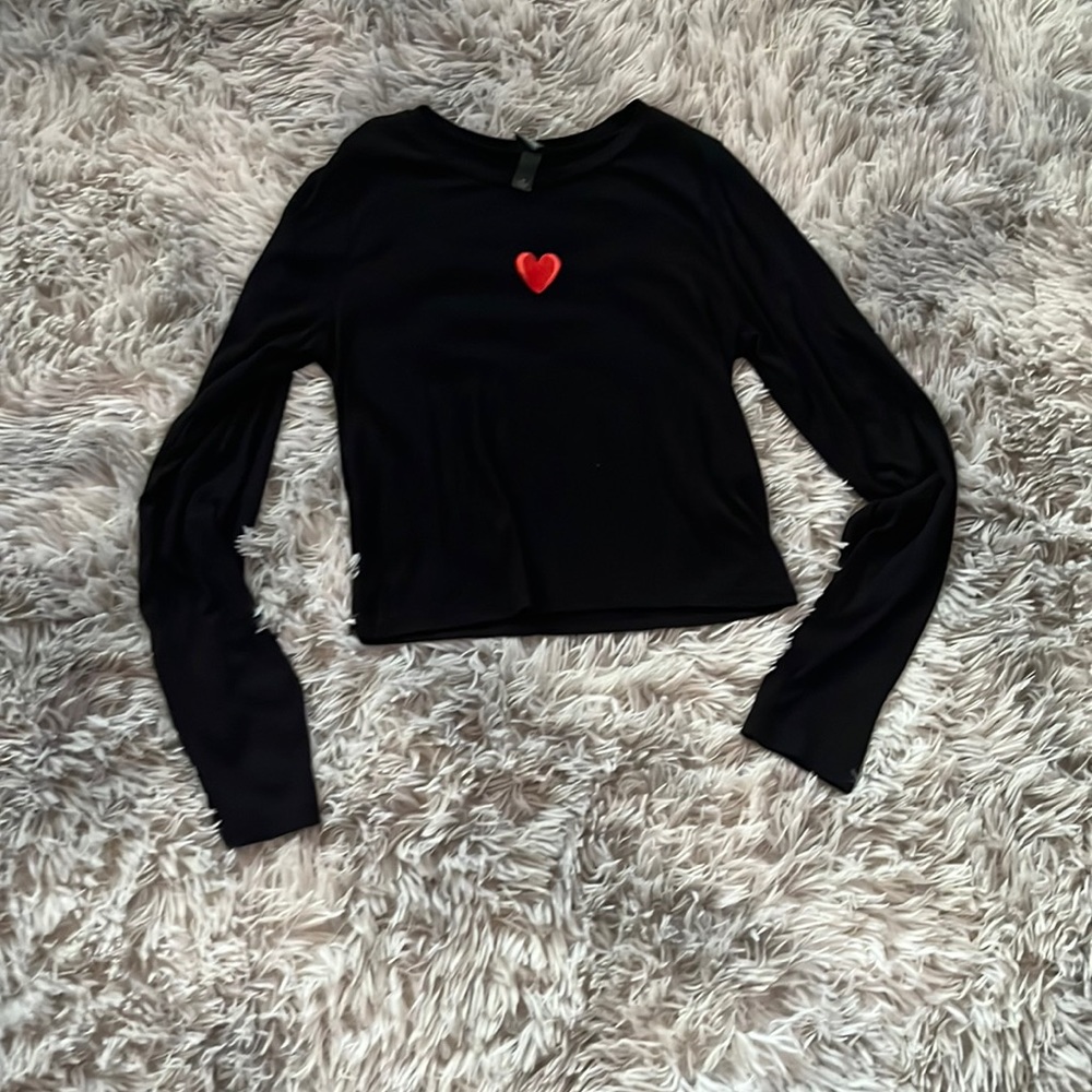 Black long sleeve top with a cute heart on the front!
